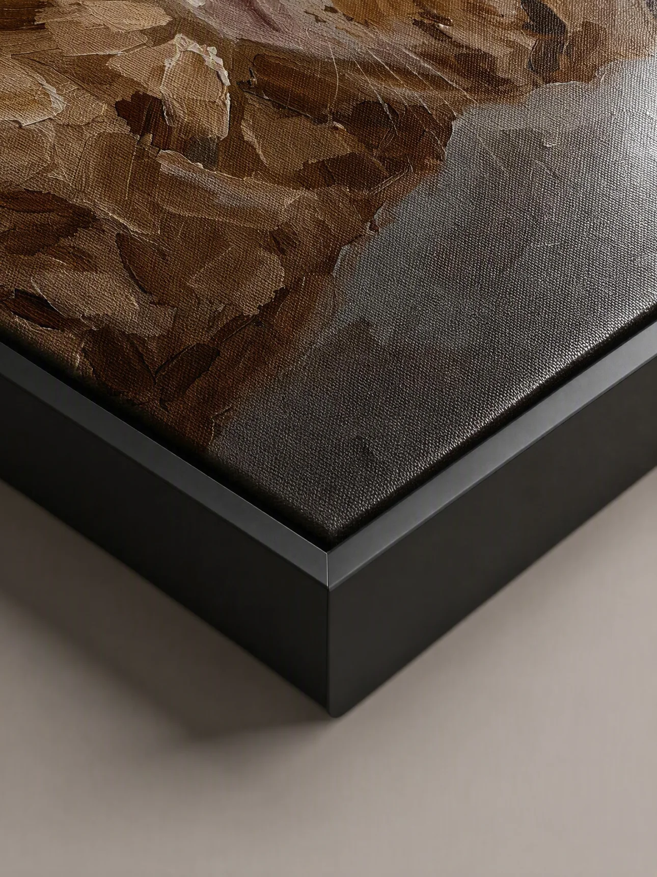 Close view of the textured canvas and black floating frame